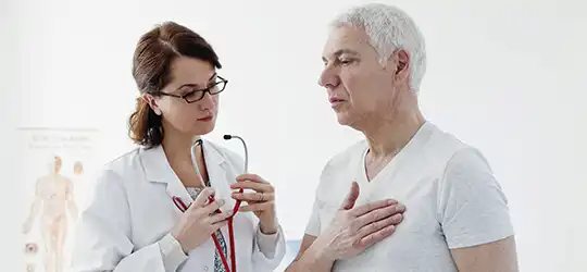 provider getting ready to listen to man's heart