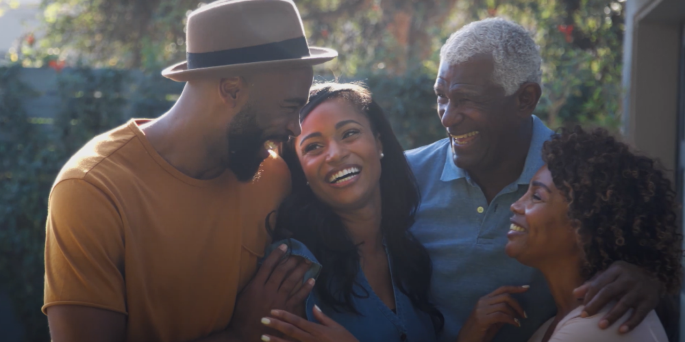 family smiling and embracing each other