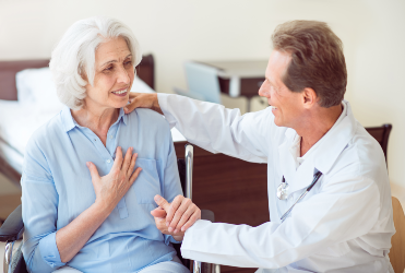 caregiver holding patient's hand