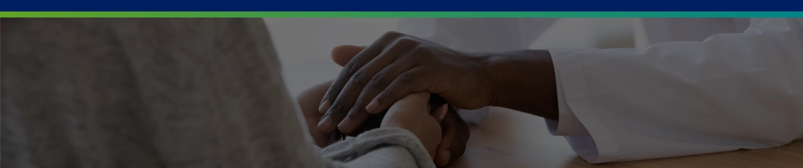 doctor holding hands with patient