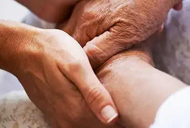 hands holding elderly hands